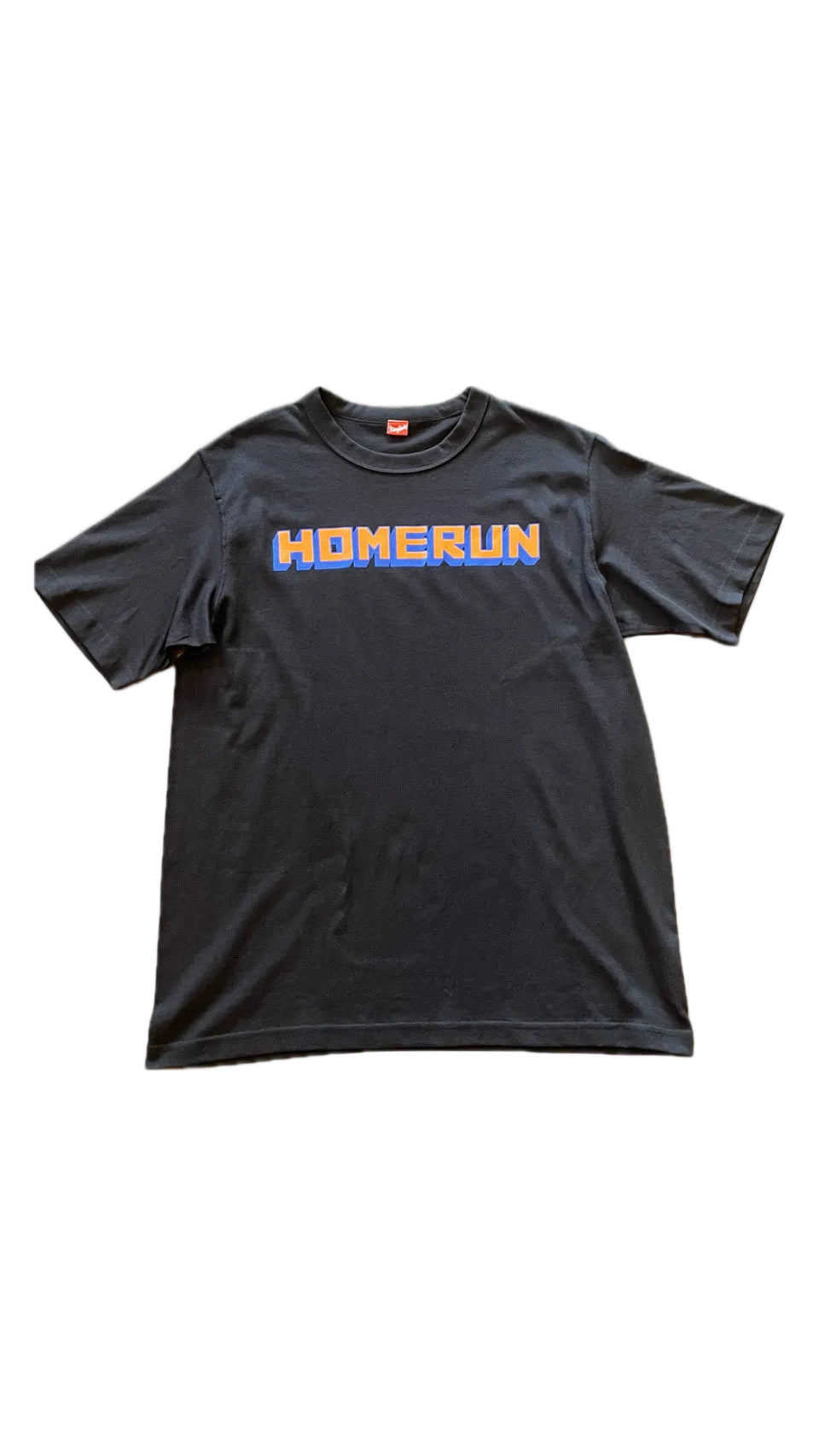 Black t-shirt with 'HOMERUN' printed in orange and blue on a white background